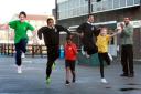 Dwight Berry, the headmaster of Usain Bolt's former school puts pupils at Orion Primary through their paces after they won a competition to be twinned with the Olympic gold medallists's former school
