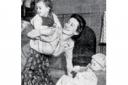 REMARKABLE MUM: This photograph of Peggy Knight with her two children is from The Women Who Lived for Danger. We believe it was taken for the Sunday Express but have been unable to verify the picture's origins      
