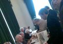 Veterans sign autographs at RAF Bentley Priory.