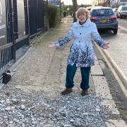Alison Hopkins says the pavement has not been repaired properly in 50 years. Photo: Adam Shaw