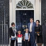 Deputy Mayor for Policing Kit Malthouse hands the petition in at Downing Street with Claire Lambert and her children and Ms Reeves