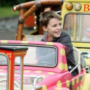 Eight-year-old James enjoys one of the fairground rides on offer.