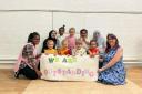 Precious playdays team and kids celebrate the 'outstanding' rating.
