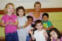 Ros Smith with members of All Saints Playgroup.