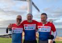 left to right: Laurence Finger, Richard Rosenberg, and Charles Bradbook pictured at John O'Groats on a previous fundraising challenge