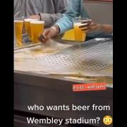 A video that went viral on social media showed a member of staff filling plastic pint glasses with beer that had collected in a pool on the bar during the fight between Tyson Fury and Dillian Whyte. Photo: TikTok/Twitter