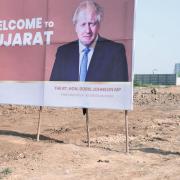A poster welcoming Prime Minister Boris Johnson during his visit to Ahmedabad in Gujarat, India. People were encouraged to turn out by the local authorities and pictures of the Prime Minister adorned every street corner. These pictures were taken from a