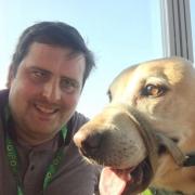 Stephen Anderson and his guide dog Barney
