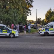 Crowds overlooking the crime scene in Stanmore on Monday (September 4)