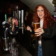 Jess Glynne behind the bar at the Hawley Arms after playing an intimate gig