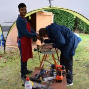 Yash Parekh making bespoke clocks at The Royal National College for the Blind