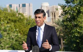 Prime Minister Rishi Sunak on the roof of the British Embassy in Dubai before attending the Cop28 summit (Stefan Rousseau/PA)